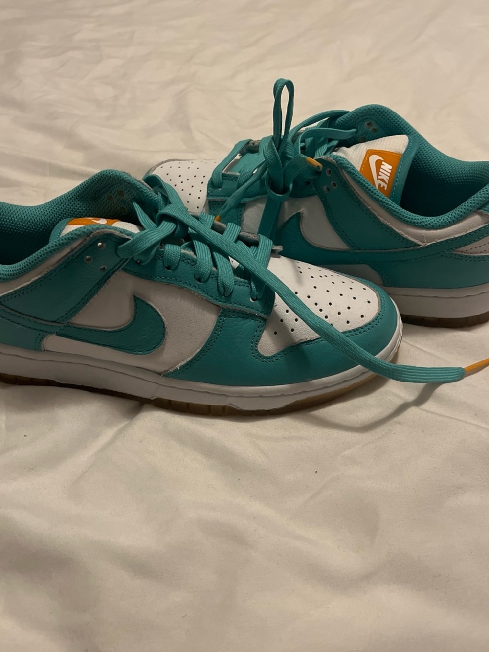 Nike Teal and White Low-Top Sneakers with Orange Tongue Accent